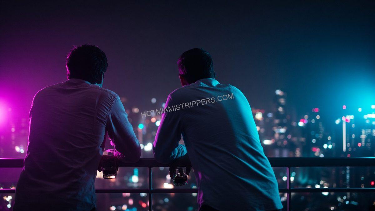 two men seen from behind leaning on a rooftop rail at night with drinks