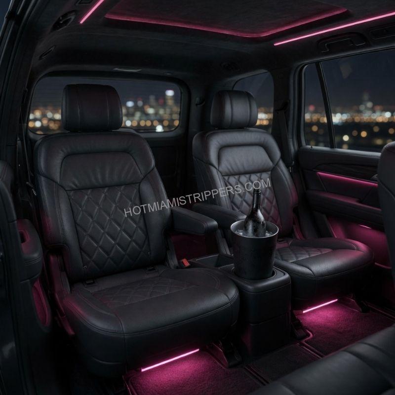 Interior of a black luxury SUV with ambient lighting and chilled drinks for a Miami group transfer