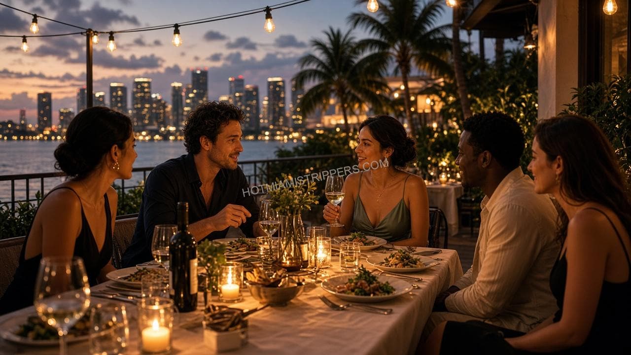 Small group sharing an evening dinner on a Miami waterfront terrace with candles and city lights