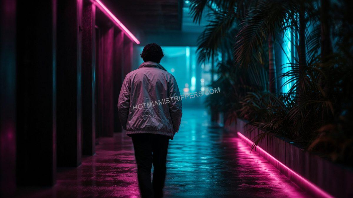 person in a light jacket seen from behind in a neon-lit hallway